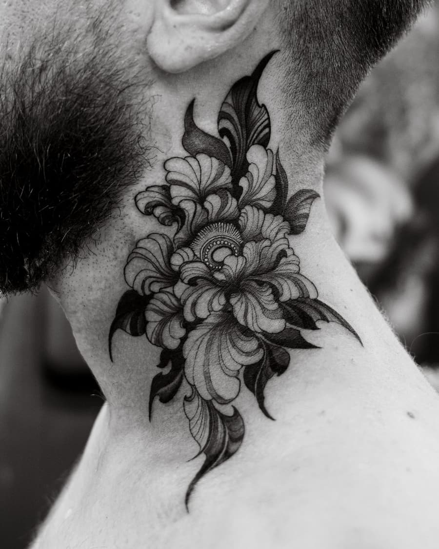 Healed blackwork peony on the side of a neck