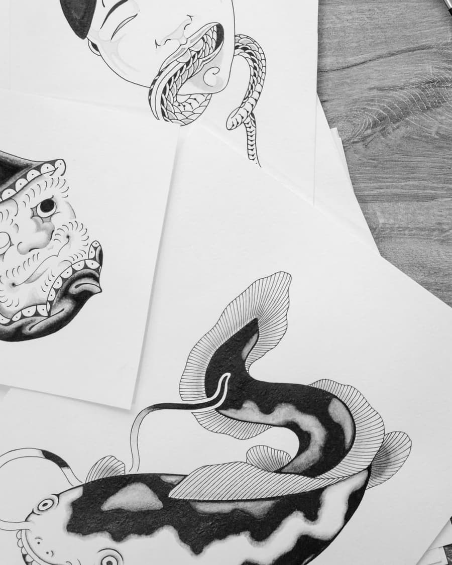 Flash drawing of a black and white catfish with long whiskers
