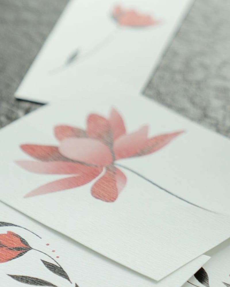 Retired colour flash card of a red lotus on a long stem